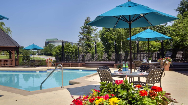 Resort-Inspired Pool with Sundeck and Tables