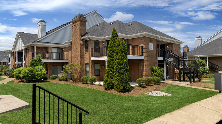 Building Exterior with Greenspace and Walkways